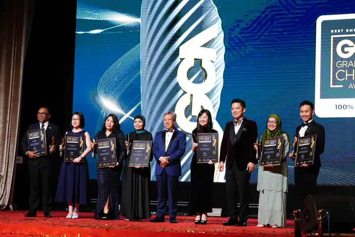Winners on stage with their plaques at the 2023 gala