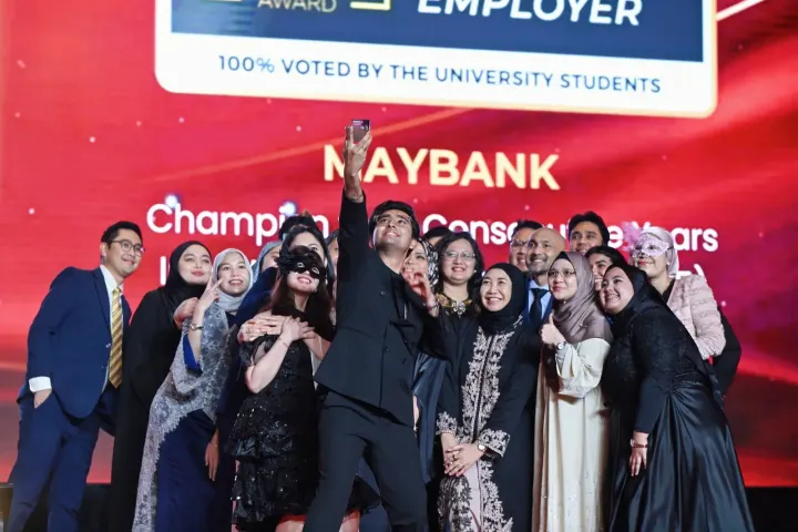 A Champion team celebrating on stage at the 2025 gala
